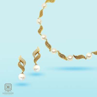 Wave drop earrings with akoya pearls